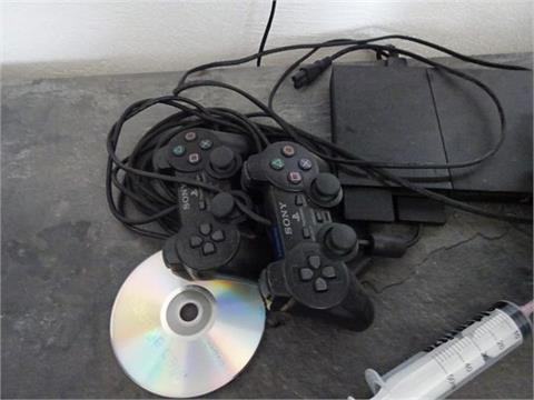 1 Playstation 2 inkl. 2 Controllern